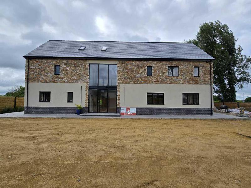 Stone-clad new build completed by RBAM Construction