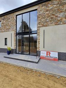 Completed entrance with full-height glazing