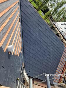 New slate roof being laid